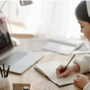 Student studying with personalized online learning on laptop